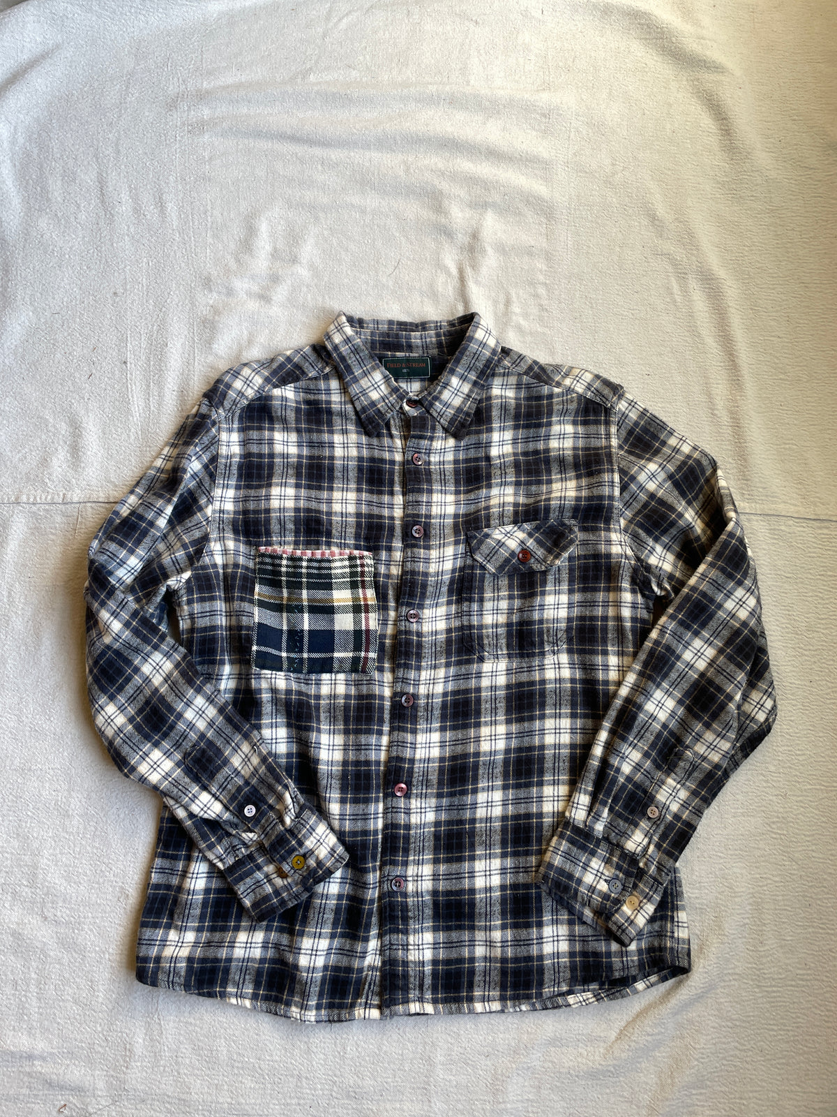 Plaid flannel shirt on a light gray background